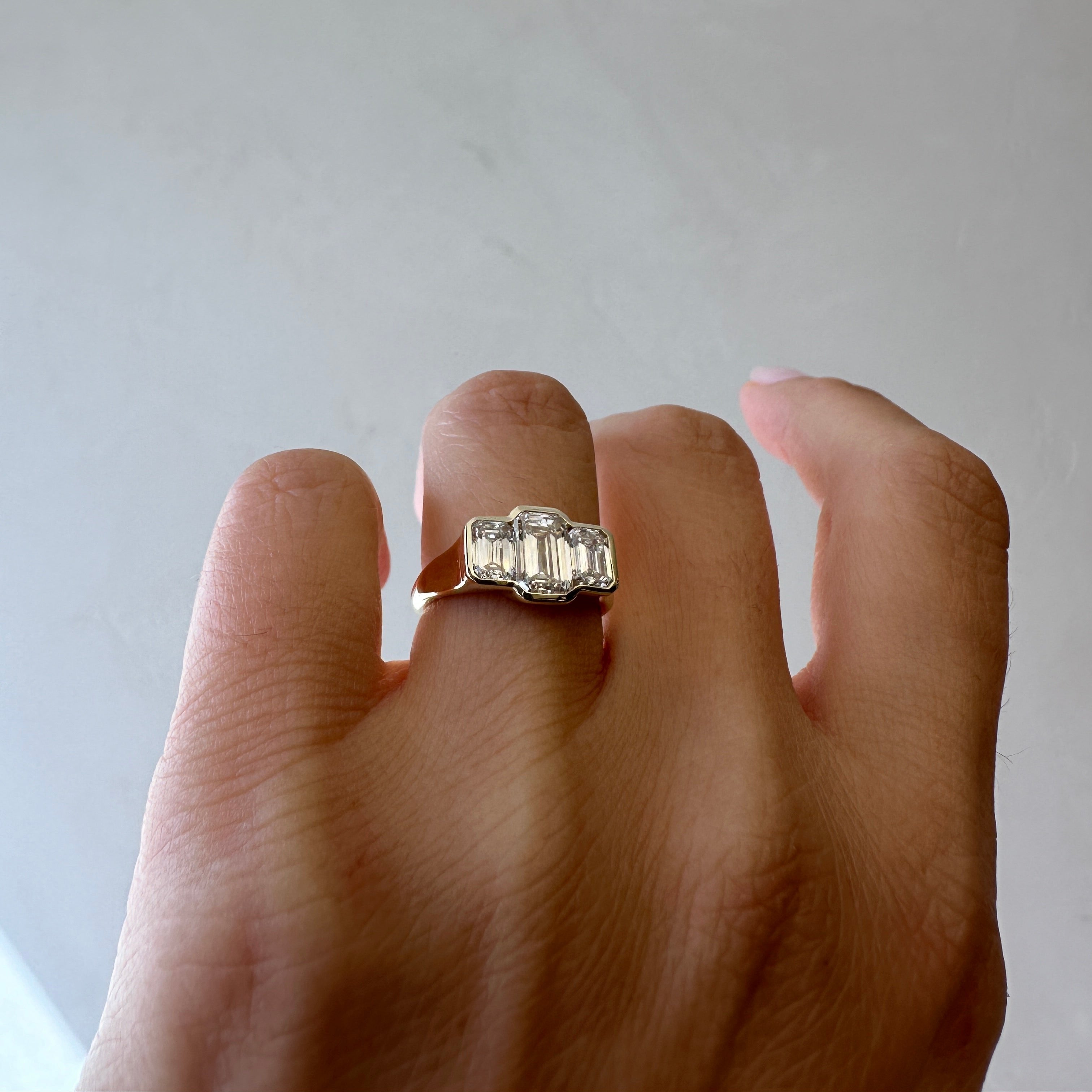 Three Stone Emerald Bezel | L