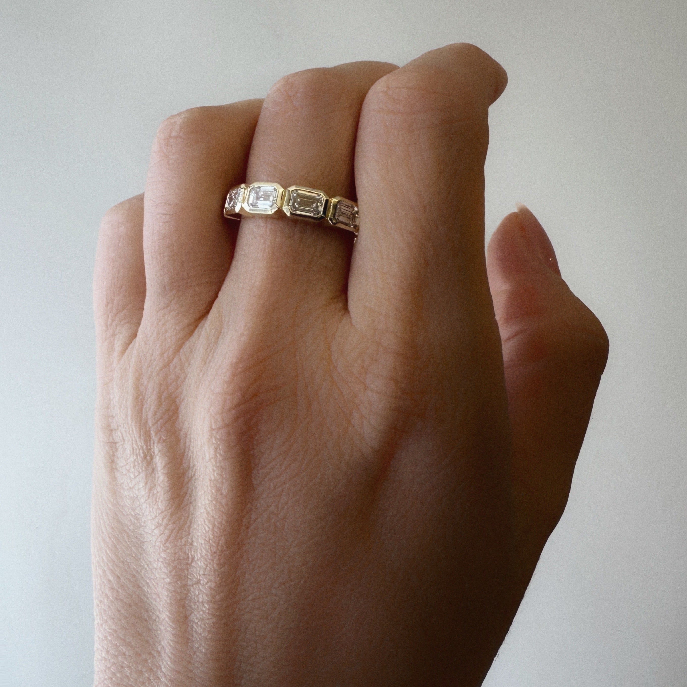 Five East-West Emerald Bezel Ring