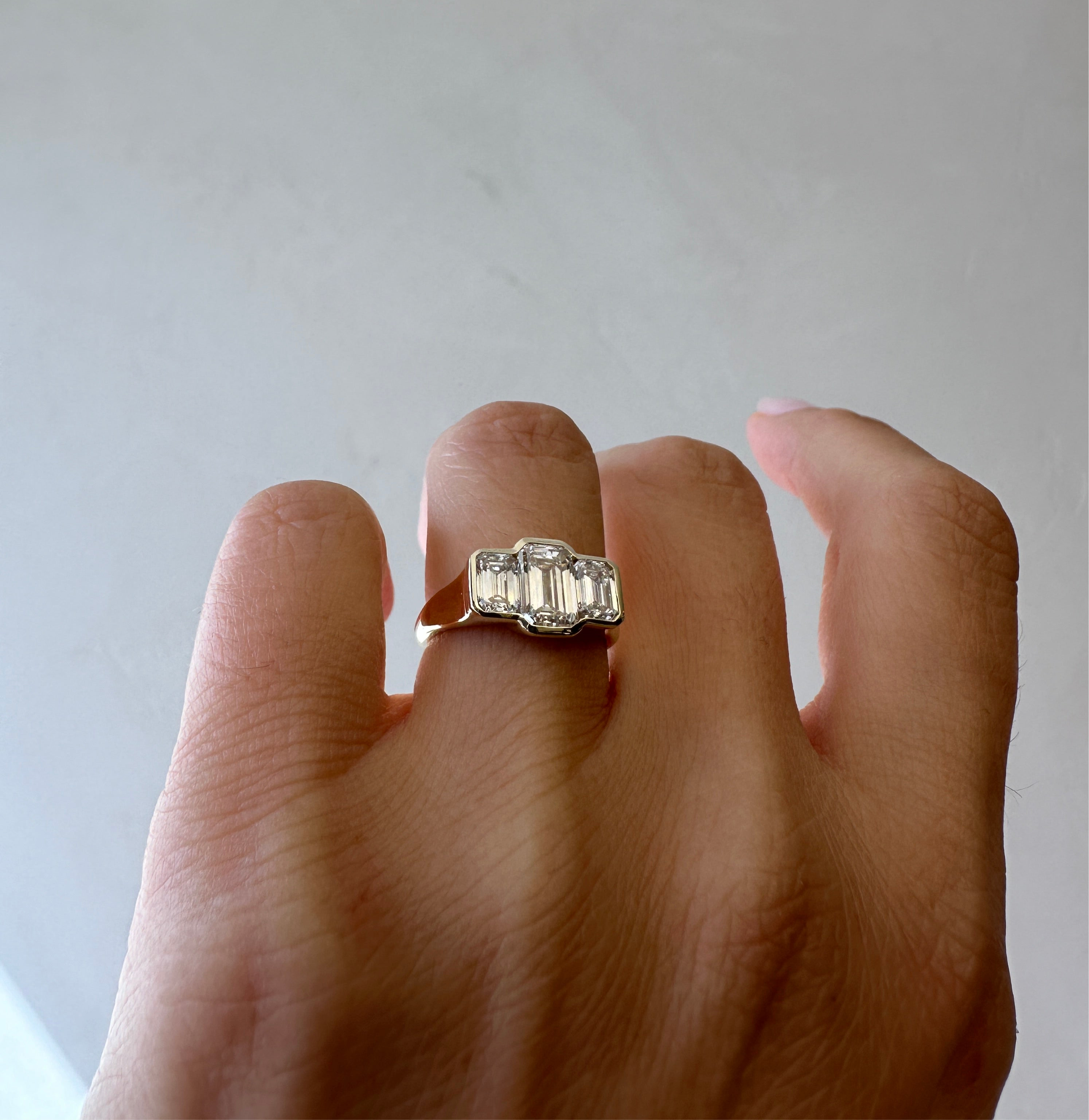 Three Stone Emerald Bezel | L